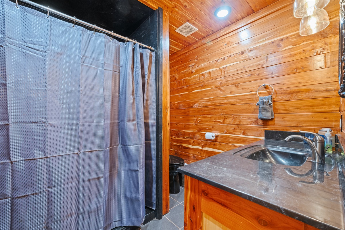 Designed with group stays in mind, this bathroom layout allows for comfortable shared use without feeling cramped.