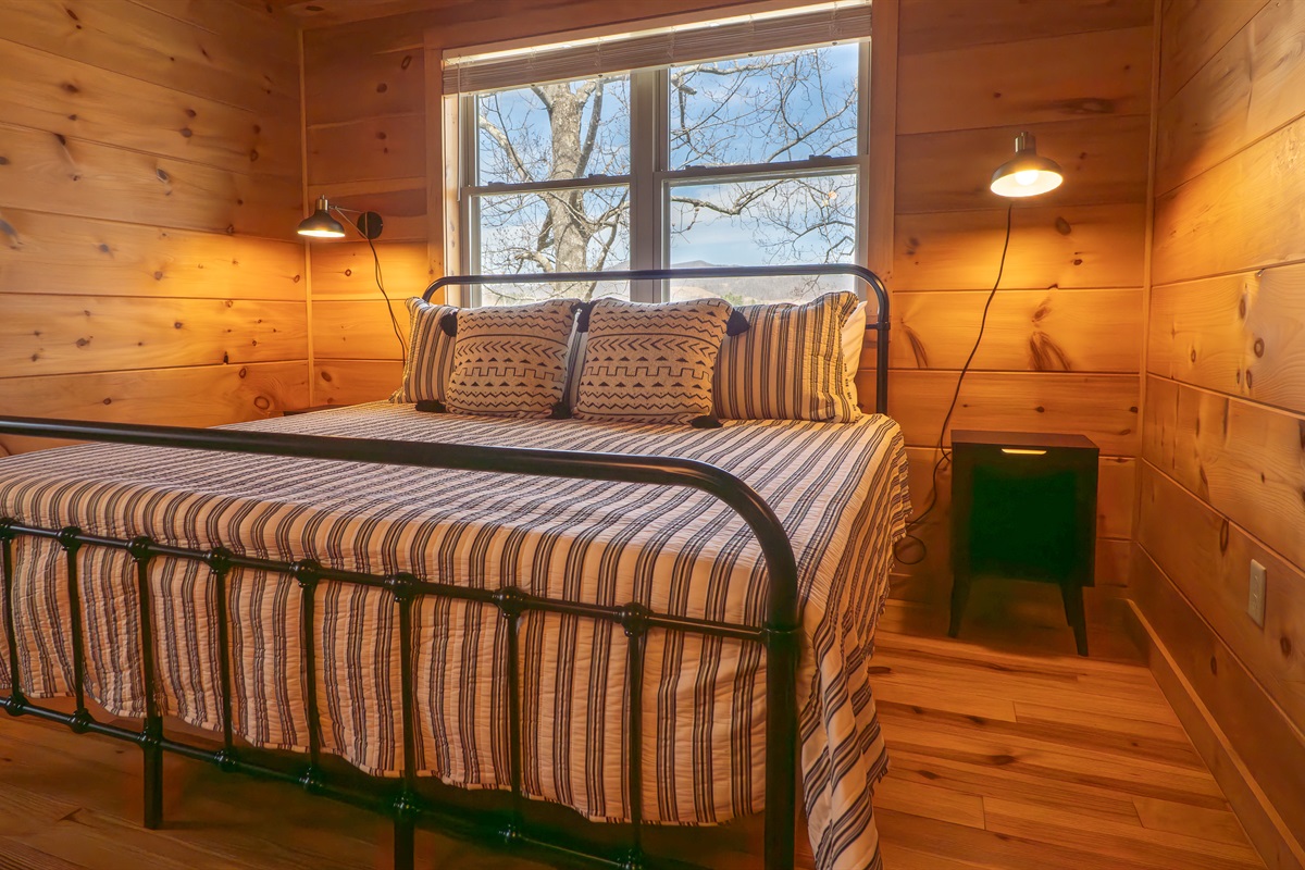 The comfortable king-size bed in the primary bedroom promises sweet dreams and a restful stay.