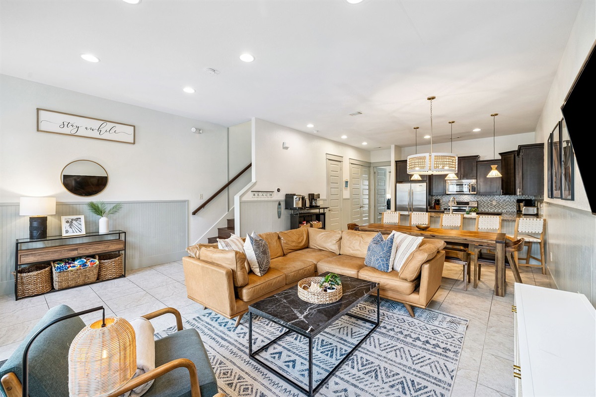 Light-filled and thoughtfully laid out, this open-concept living area creates the perfect atmosphere for movie nights, shared meals, or morning coffee chats before a day of adventure.
