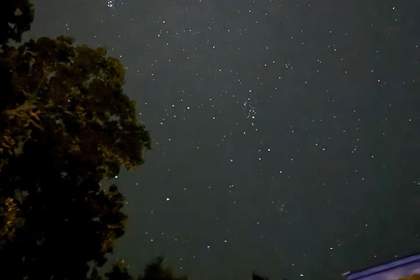 View of stars from pool at night