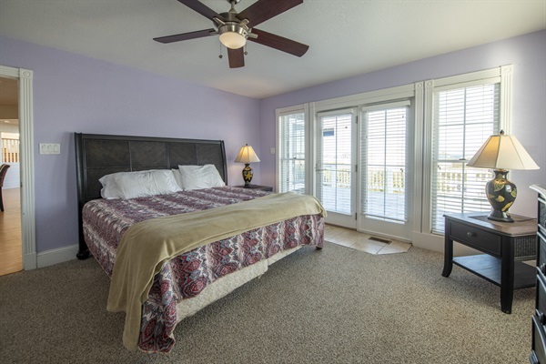 Enjoy all the wonders of The Hemingway's master bedroom while taking in the sights and sounds of the Outer Banks. Take a step out onto the private deck and experience nature first-hand. A perf