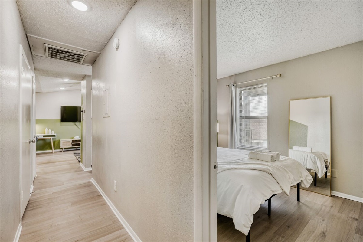 Bright, modern apartment with cozy bedroom and open living space.