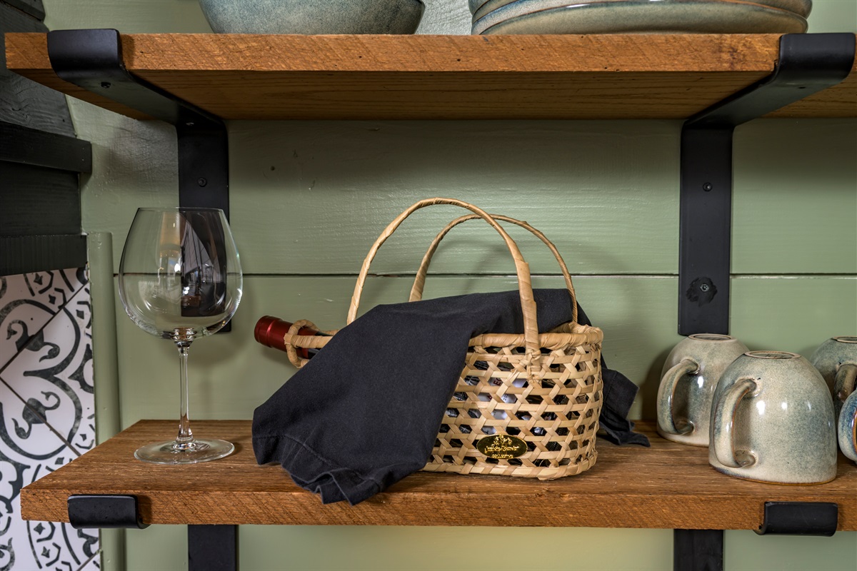 A quiet moment waiting to happen — pour a glass, slow down, and settle into the comfort of the cabin.