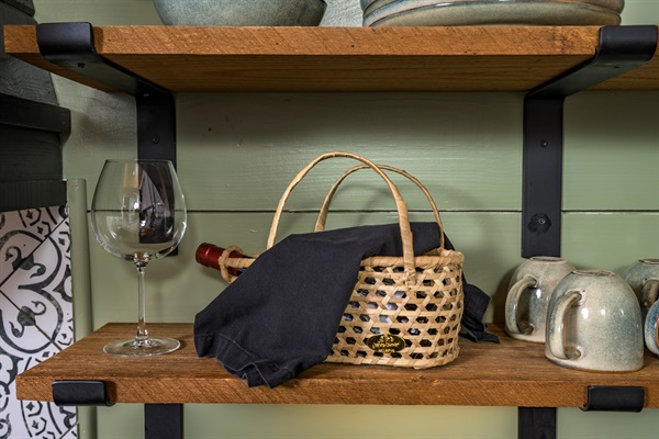 A quiet moment waiting to happen — pour a glass, slow down, and settle into the comfort of the cabin.
