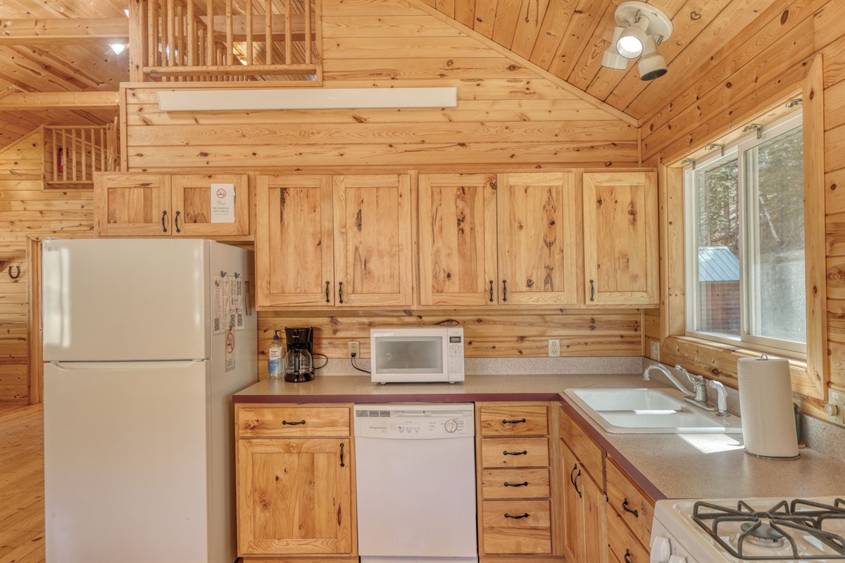 Kitchen with oven, stove, microwave
