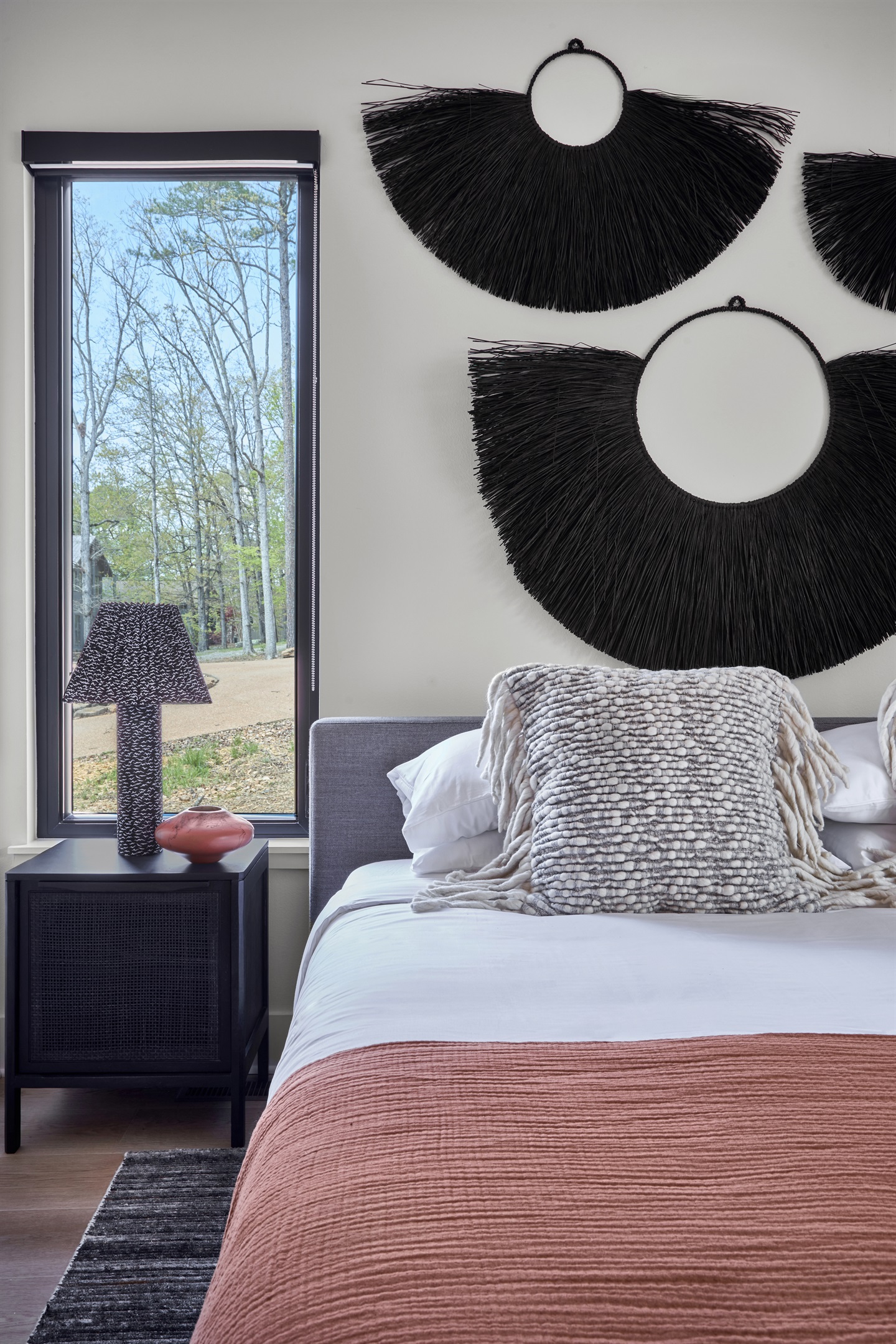 Unwind in your own sanctuary with curated art, luxury bedding, and views of the surrounding trees.