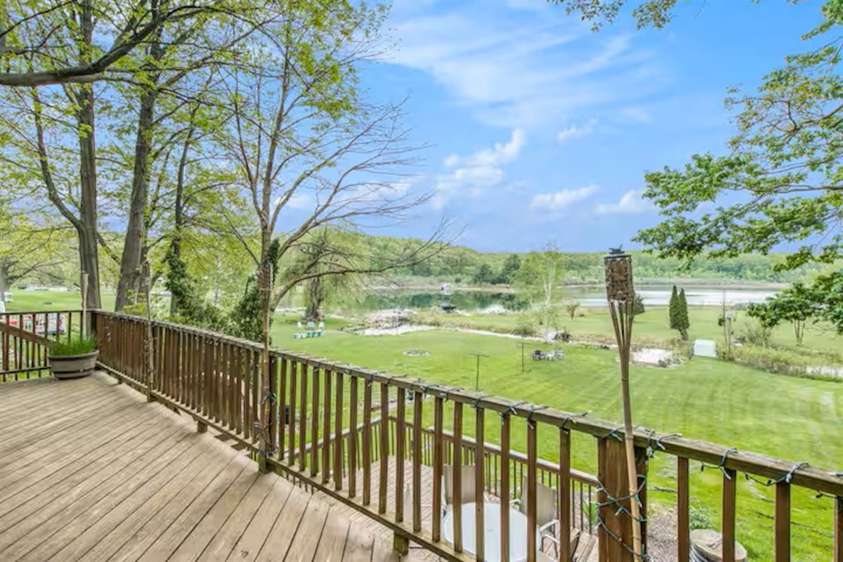 Very spacious yard that leads down to the lake with your own private dock. Also not shown here is a large seating area with a fire pit in center of yard.