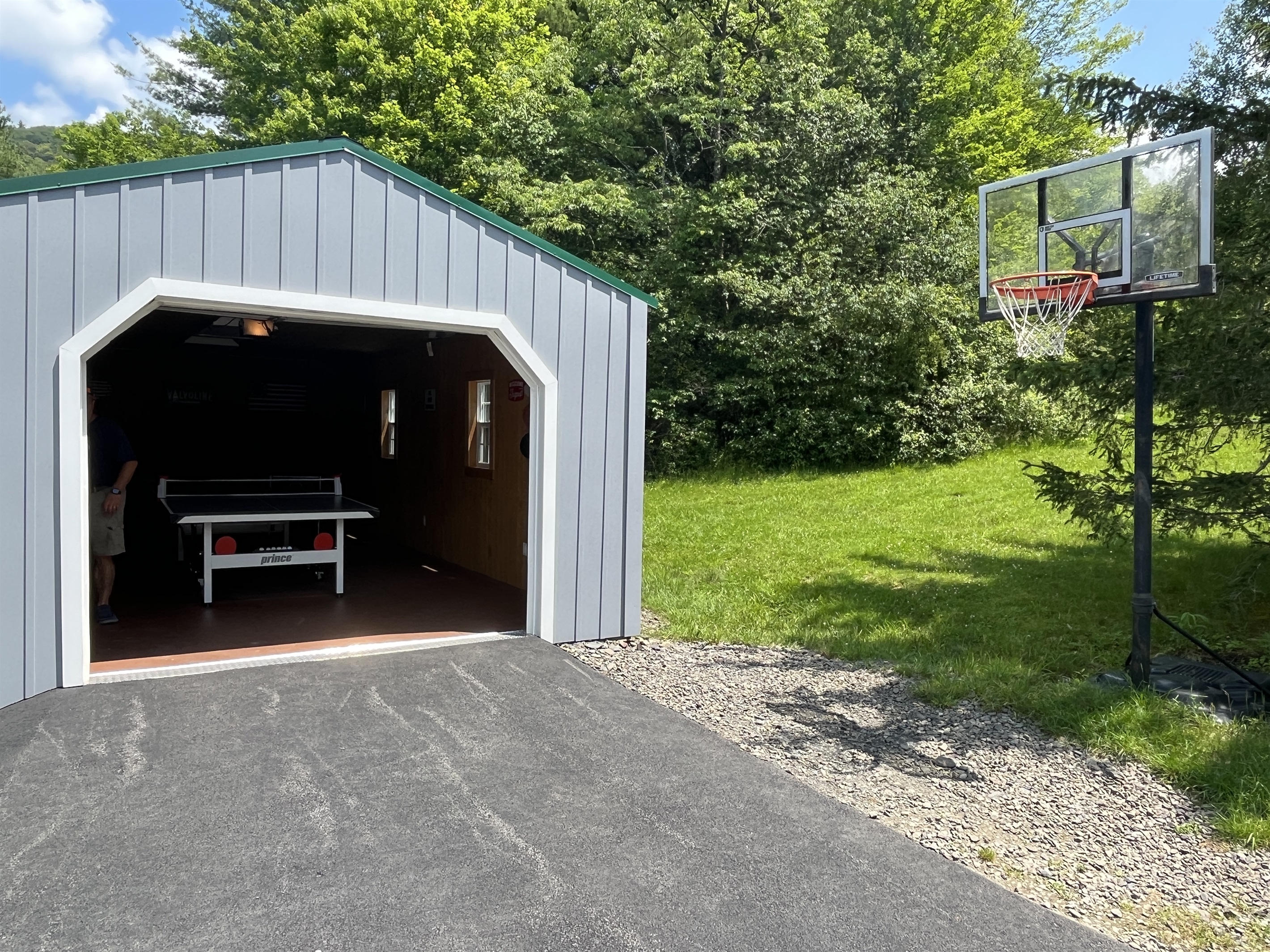 Garage game room with ping pong, foosball and air hockey.