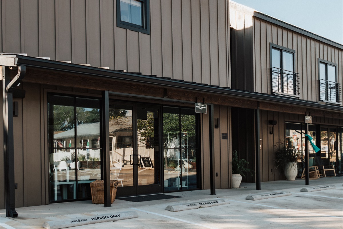 On-site parking at Gaines Ranch on the Square — dedicated spaces for the entire group, with smart-lock self check-in at every suite. No front desk, no waiting.