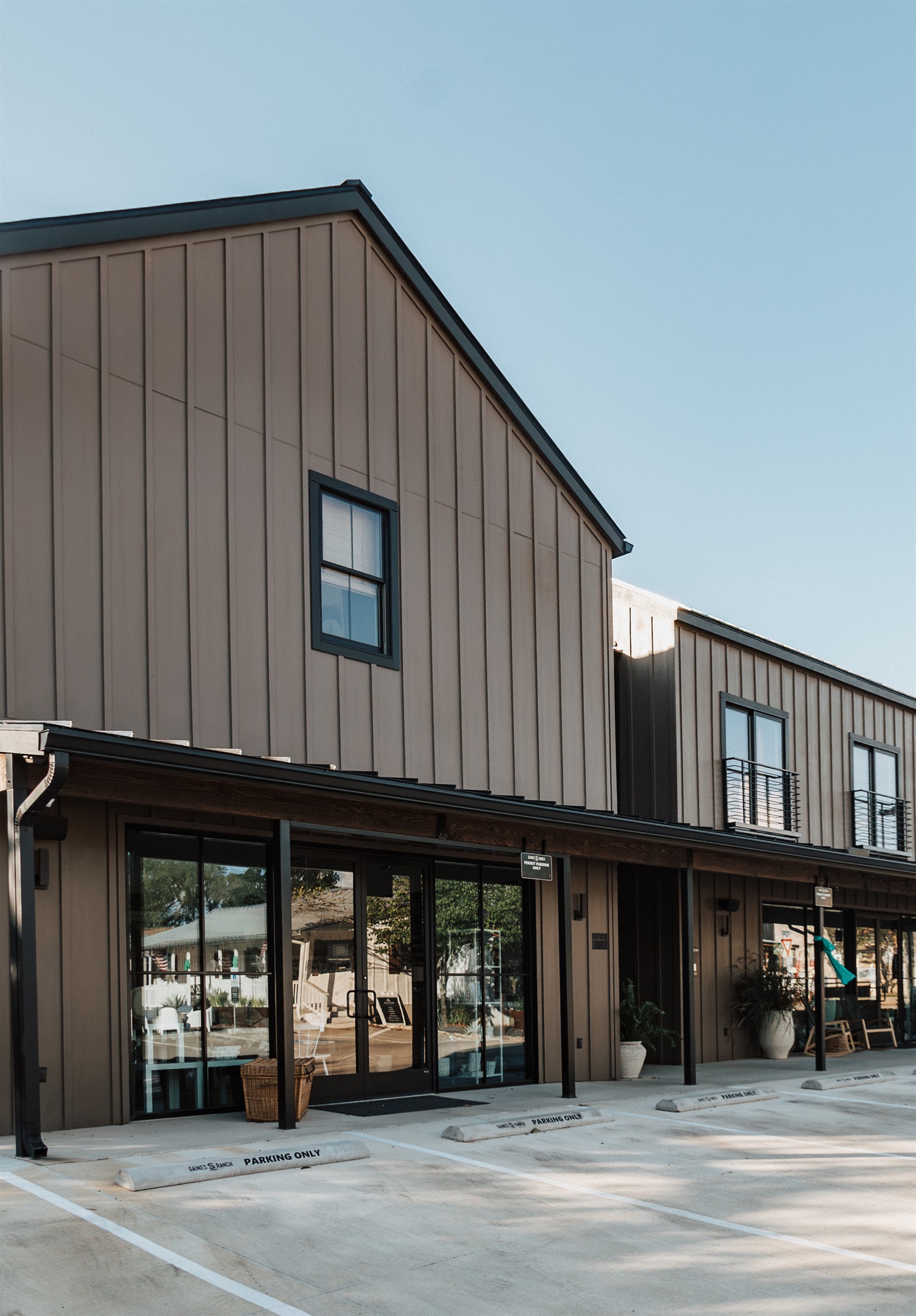 On-site parking at Gaines Ranch on the Square — dedicated spaces for the entire group, with smart-lock self check-in at every suite. No front desk, no waiting.