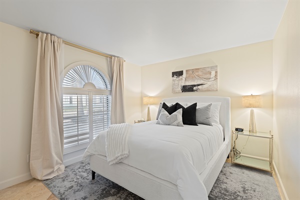 Comfortable guest bedroom with natural light and stylish design