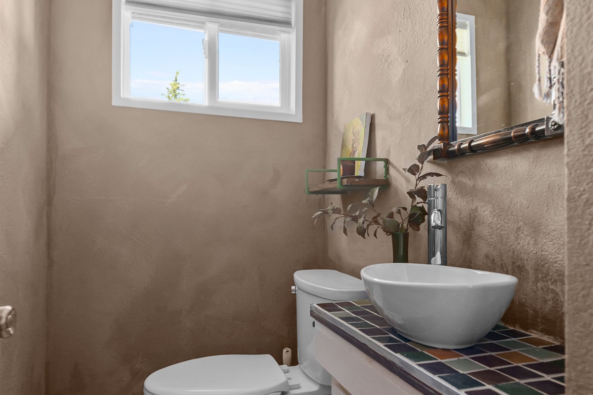 Bright and modern half bath on the first floor.