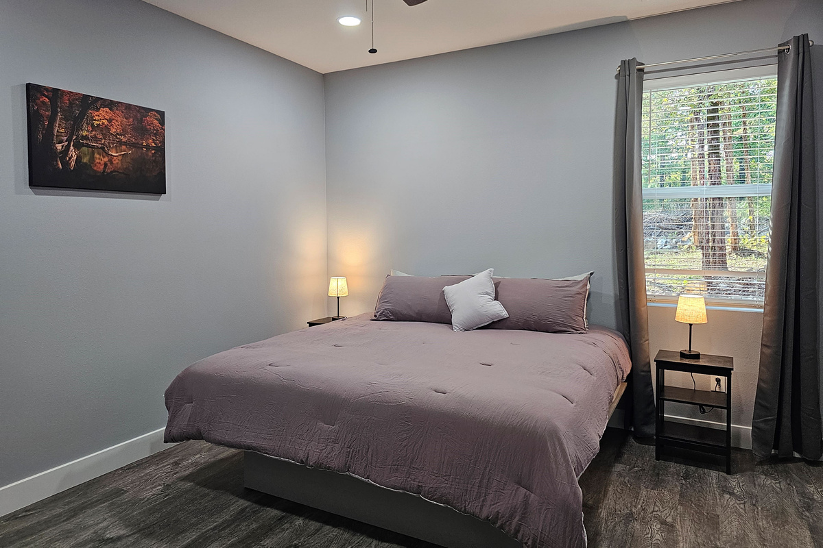 Cozy private King suite with soft modern touches.