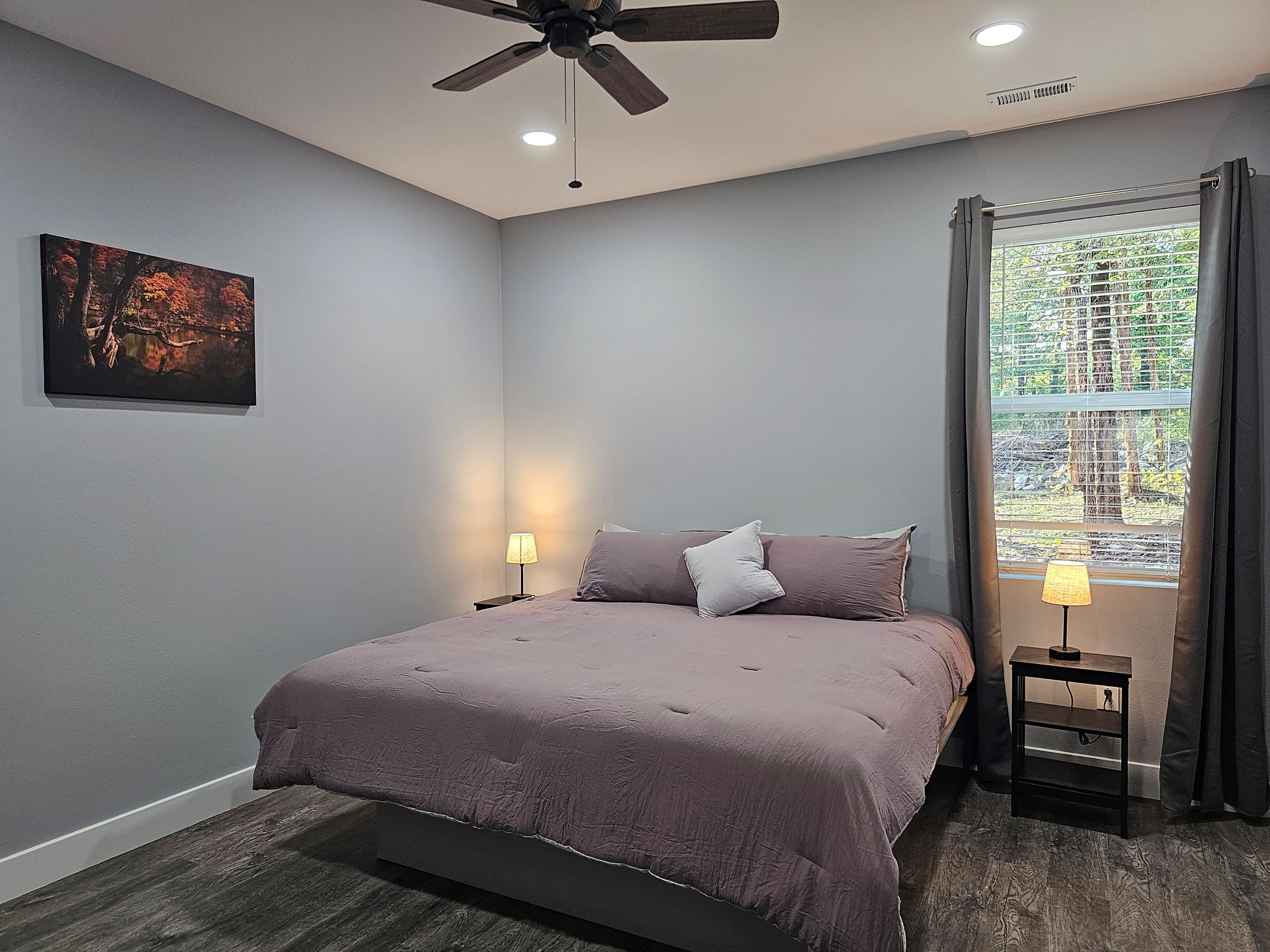 Cozy private King suite with soft modern touches.