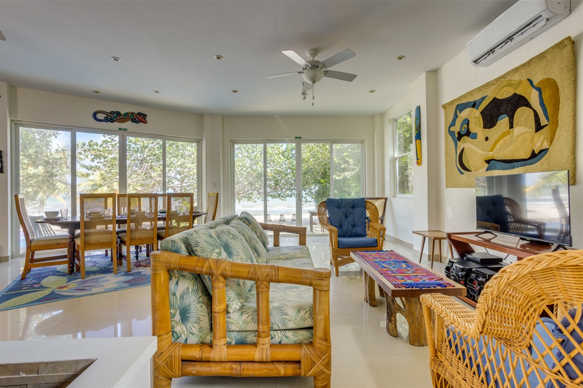 Living room with pool and beach view