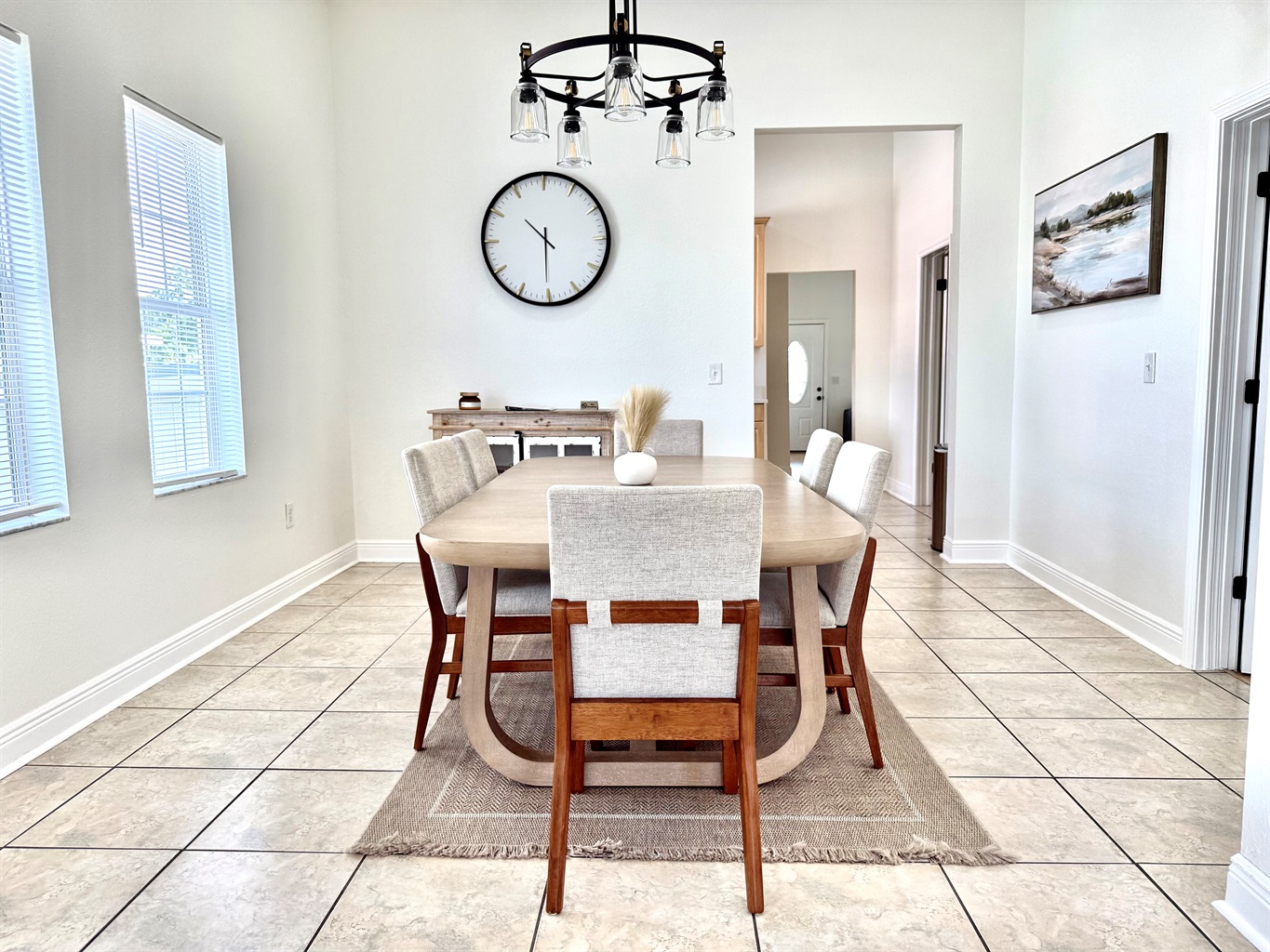 A warm, inviting dining space featuring plush seating and modern farmhouse touches for a homey feel.