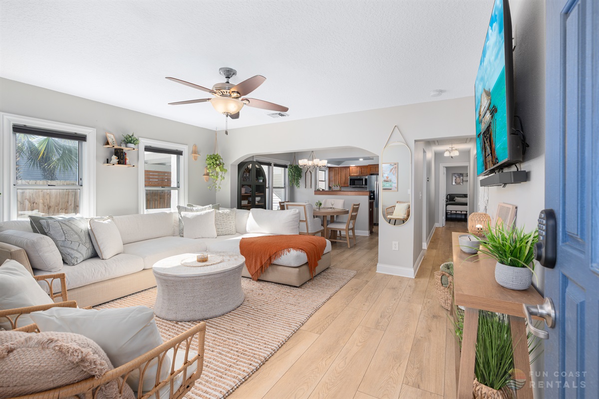 Spacious Living Room area with ample lounging space and 65" Smart TV
