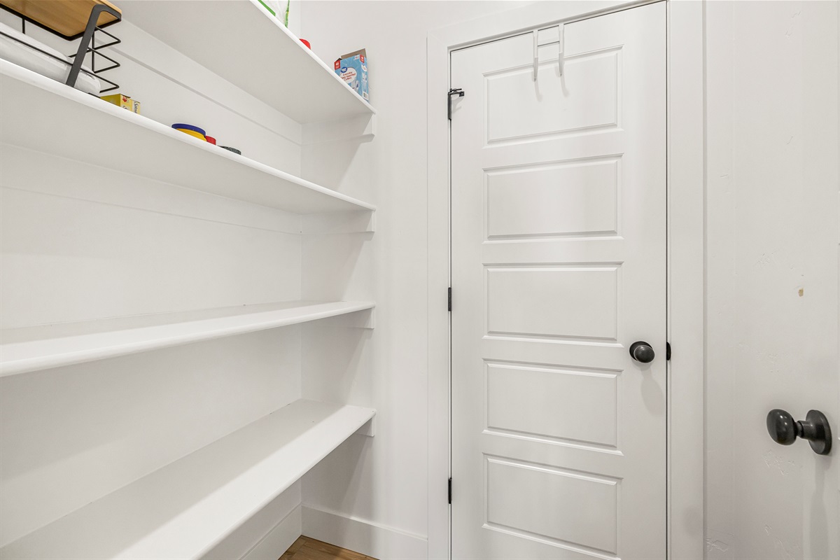 Walk-in kitchen pantry with lots of storage and easy access.