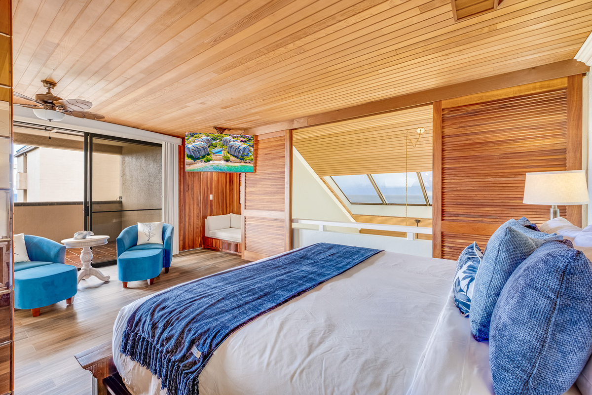 Upstairs primary suite!  Extra privacy away from it all, with a huge en suite bathroom, large closet, and access to the large upper lanai! Plus a cozy corner reading nook!  