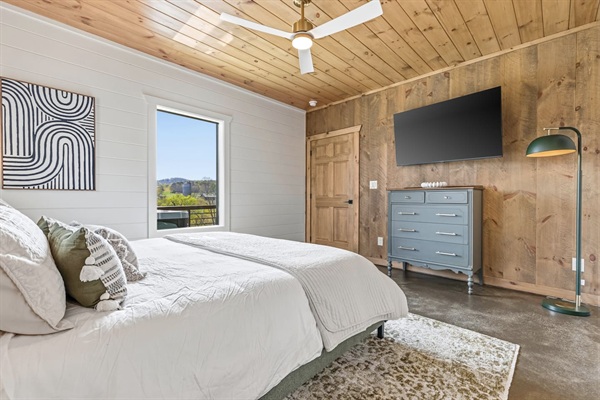 Highlights include a stunning custom crisp white cotton linens, a ceiling fan, black-out shades, a beautifully refurbished antique dresser by a local artisan, a 55” wall-mounted TV, and peaceful mountain views — perfect for relaxing evenings.