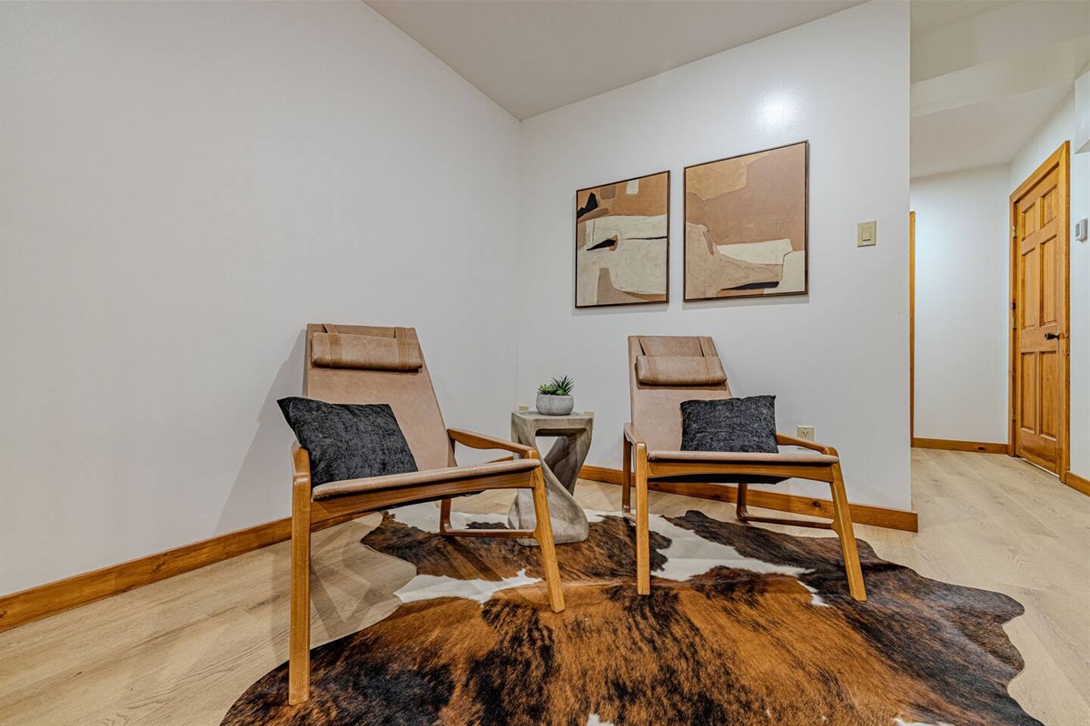 Tucked away on the upper level, this intimate seating area invites you to slow down and savor a peaceful moment away from the bustle below.