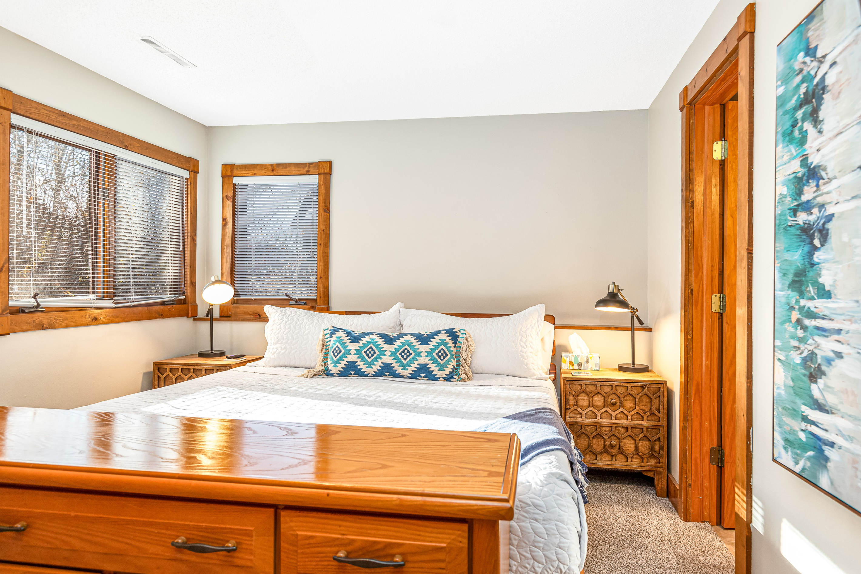 Bedroom 3 featuring a King bed and a Roku Smart TV, and an ensuite bathroom; one of three bedrooms located on the lower level.
