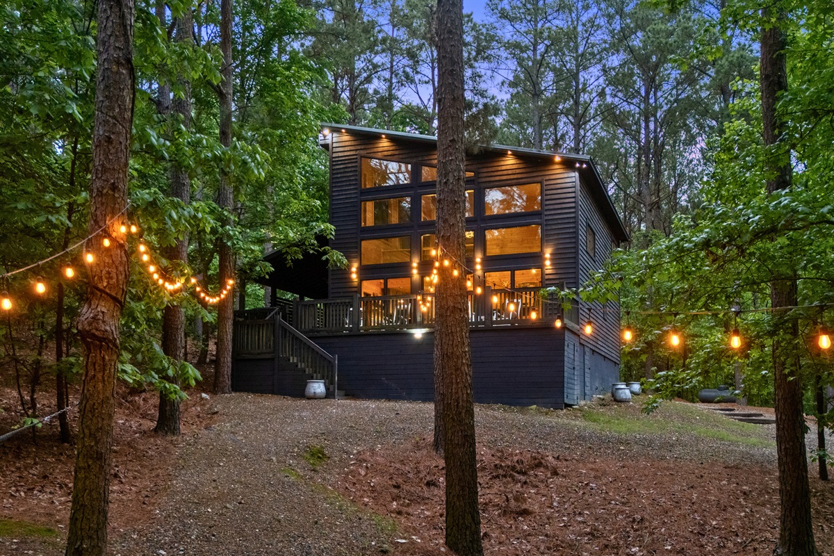 As evening sets in, the warm interior lights make the cabin feel especially inviting from the outside.