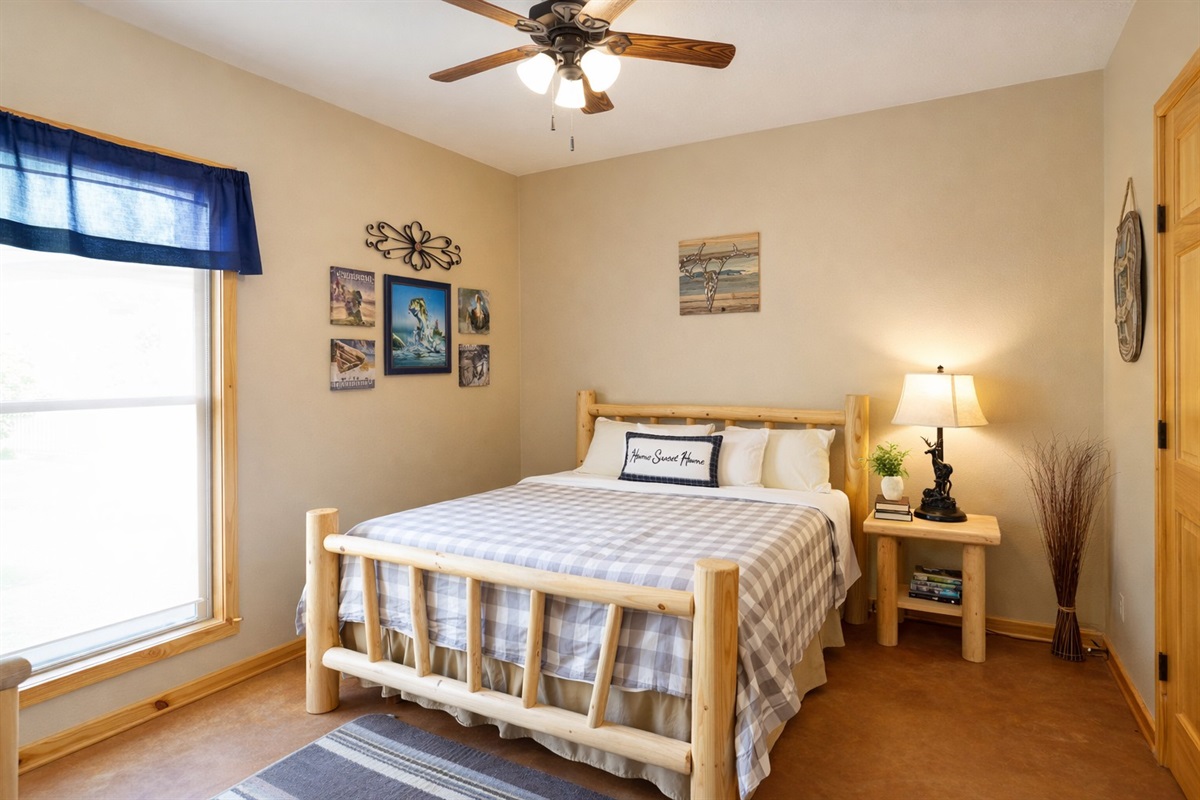 Main Floor Queen Bedroom #2 with Smart TV + ensuite bath (hallway access).