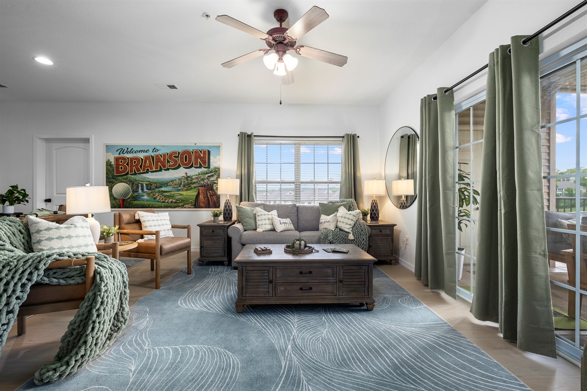 The living area is comfy and includes a queen sleeper sofa for extra sleeping area