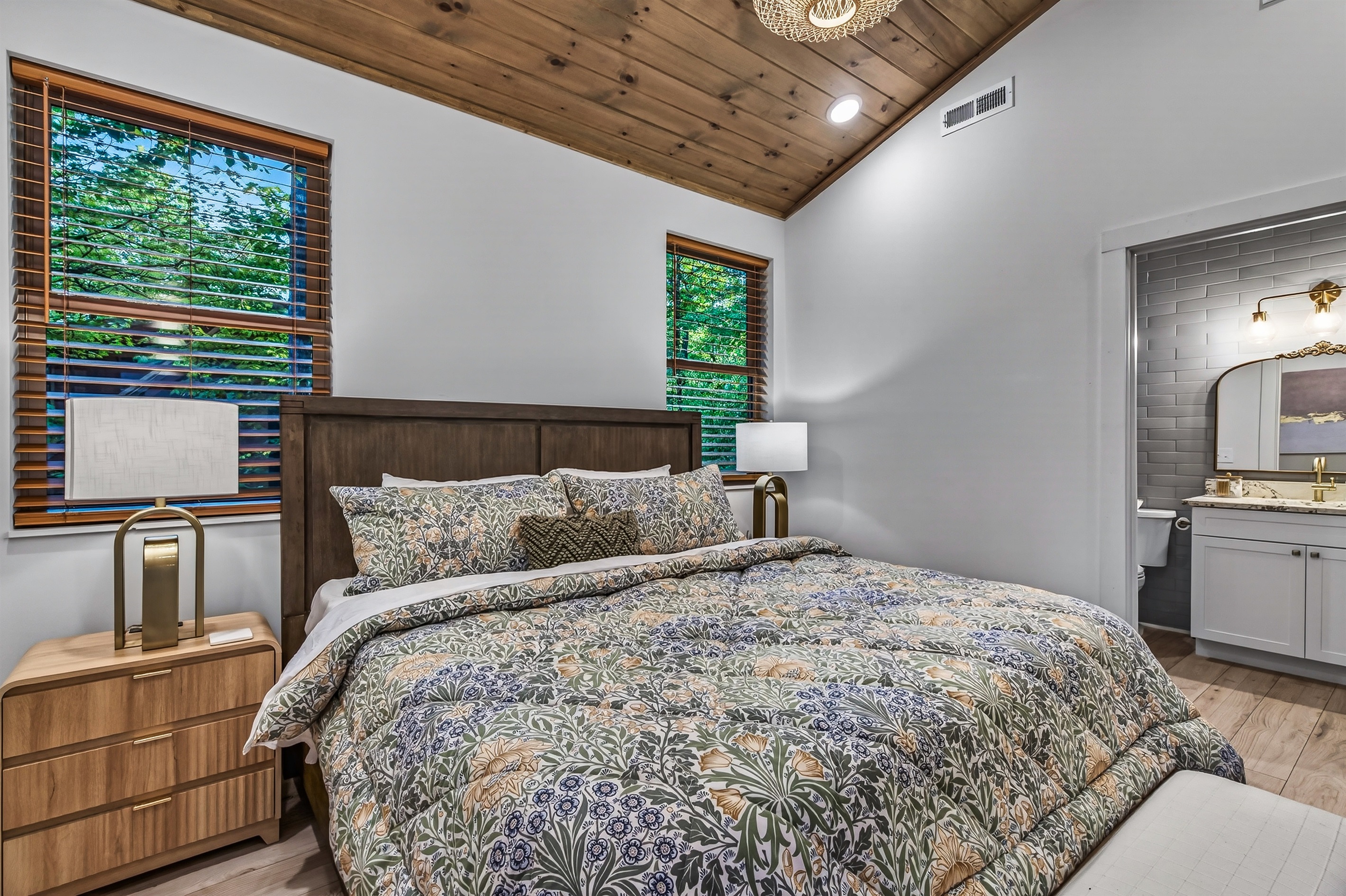 Master bedroom with night stands and  integrated charging ports