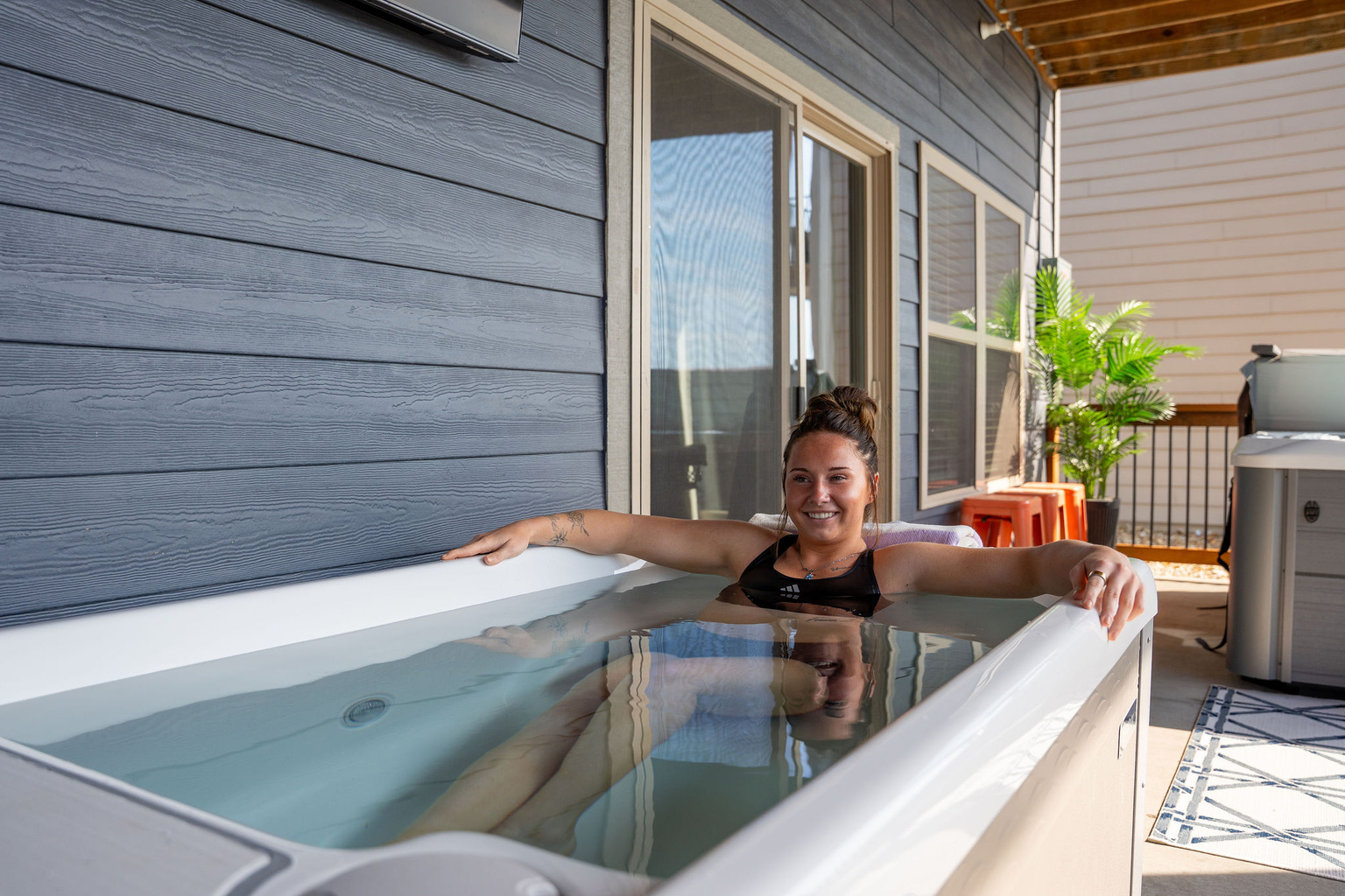Guest taking a quiet moment in the private cold plunge