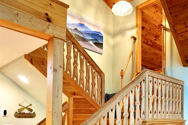 Staircase: Ascend to adventure with stunning woodwork and mountain views around every corner!