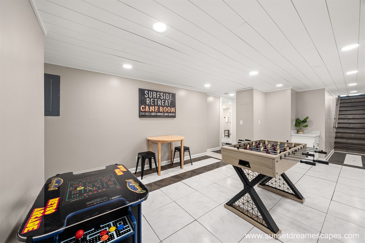 Surfside Retreat's game room includes a Foosball table, card table, and a 2-player multicade. Additionally, games are located in the TV console upstairs.