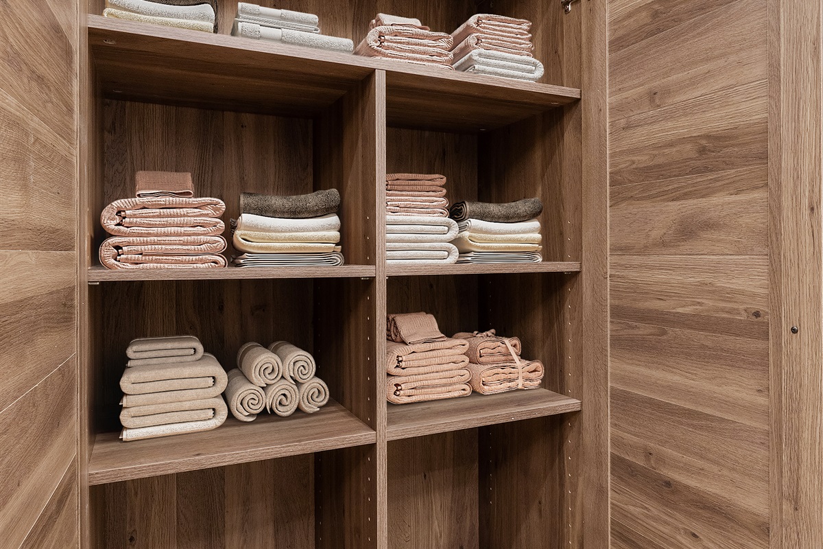 Convenient towel storage is located in the master closet, keeping essentials organized and easily accessible.
