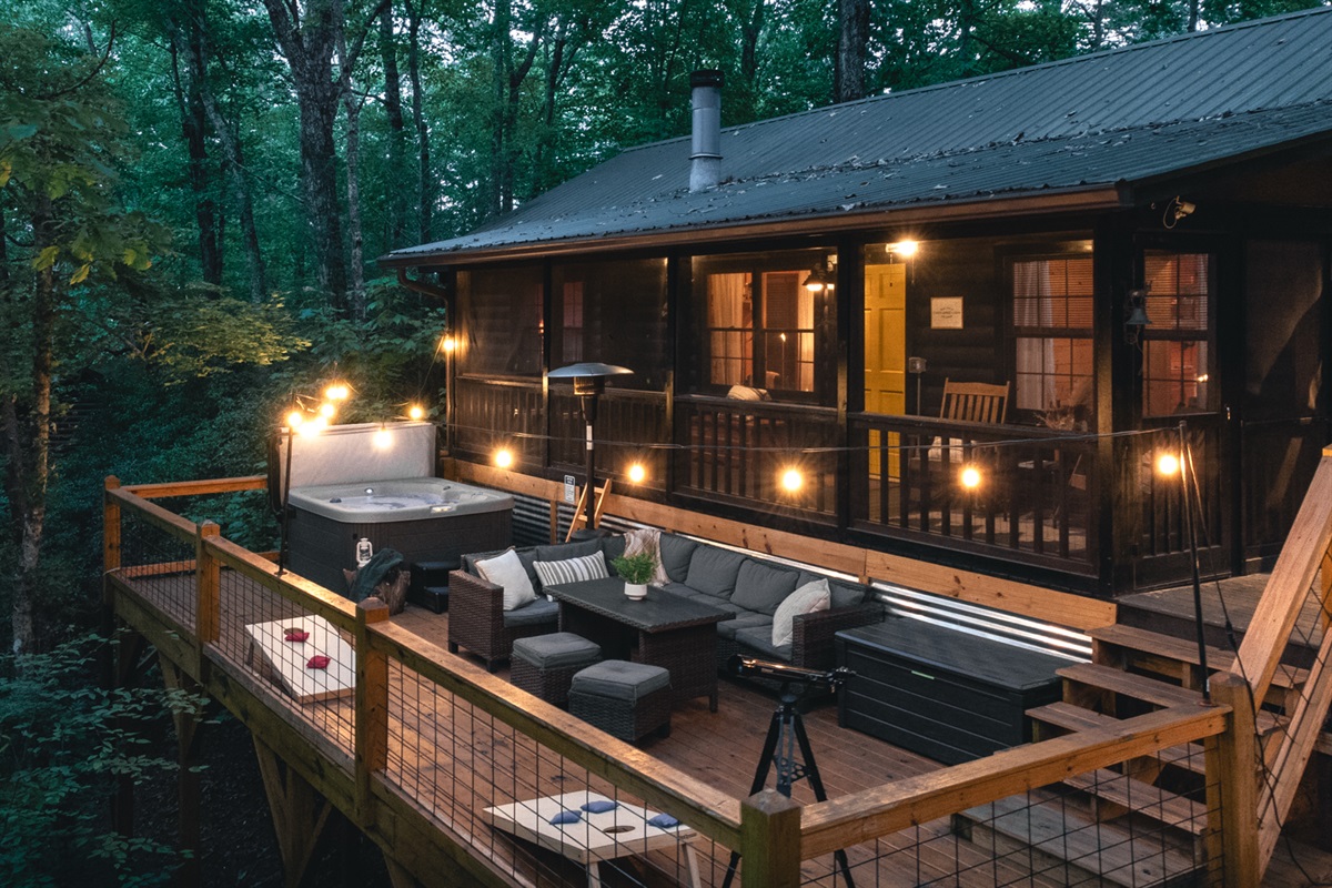 Relax under the trees on the large outdoor deck