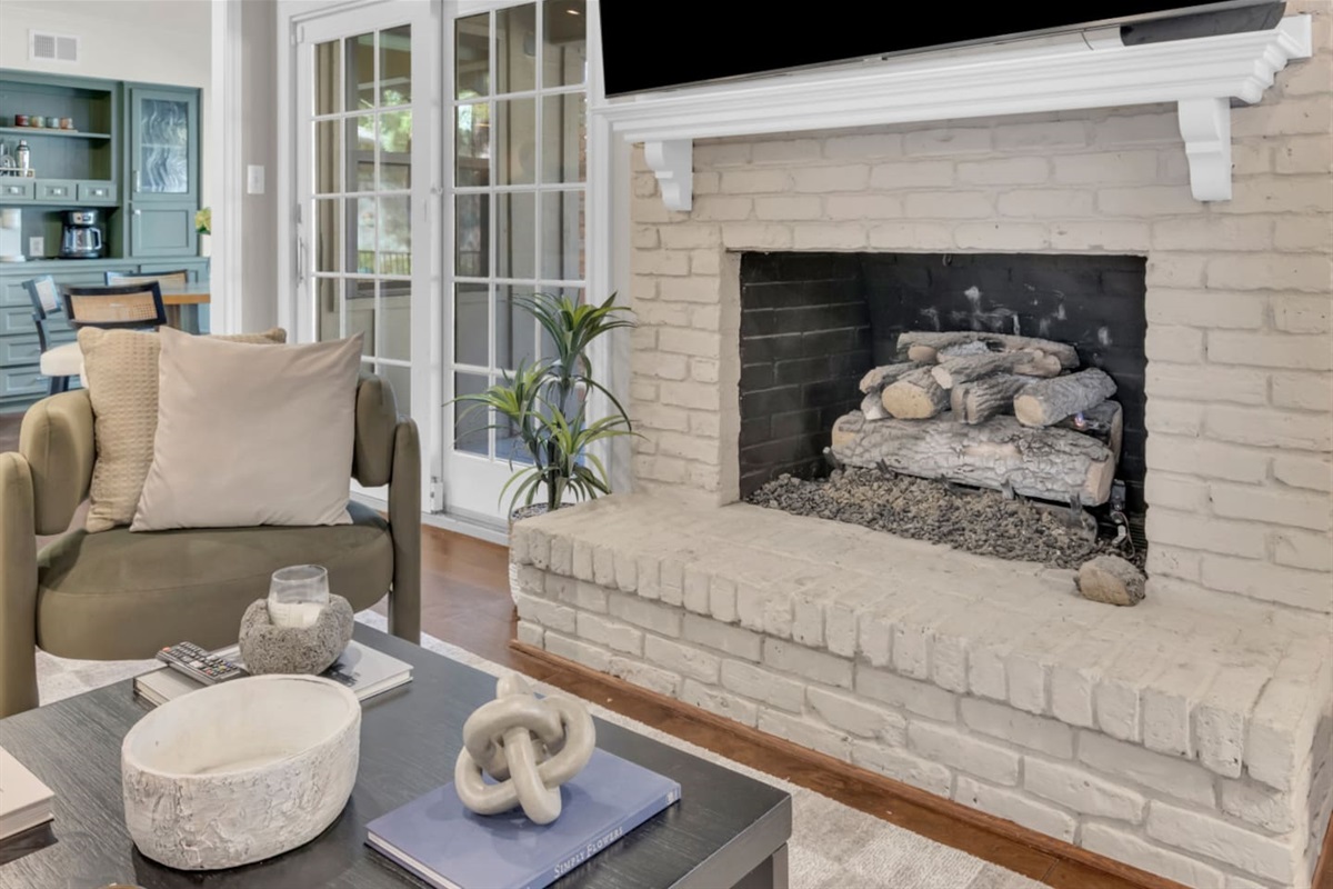 Cozy gas fireplace creating a warm and inviting focal point in the living room.