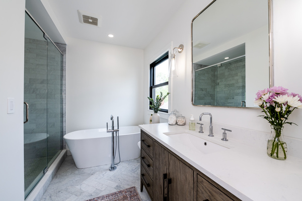 Soaking tub, marble tile, quartz countertop