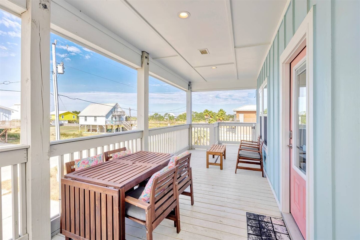 Outdoor dining on front covered porch