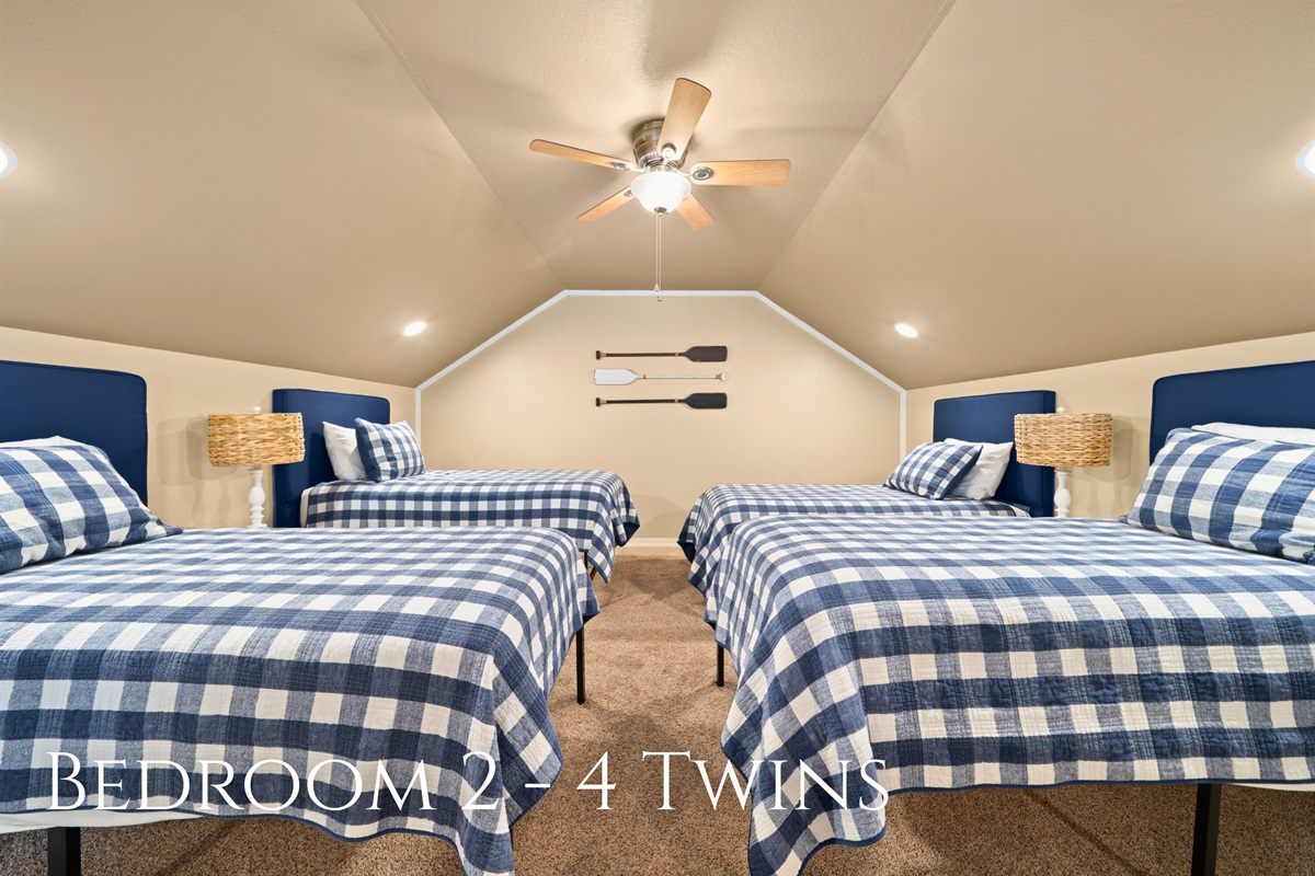 The loft provides a fun and comfortable sleeping area with four twin beds, perfect for kids or guests who enjoy hanging out together.