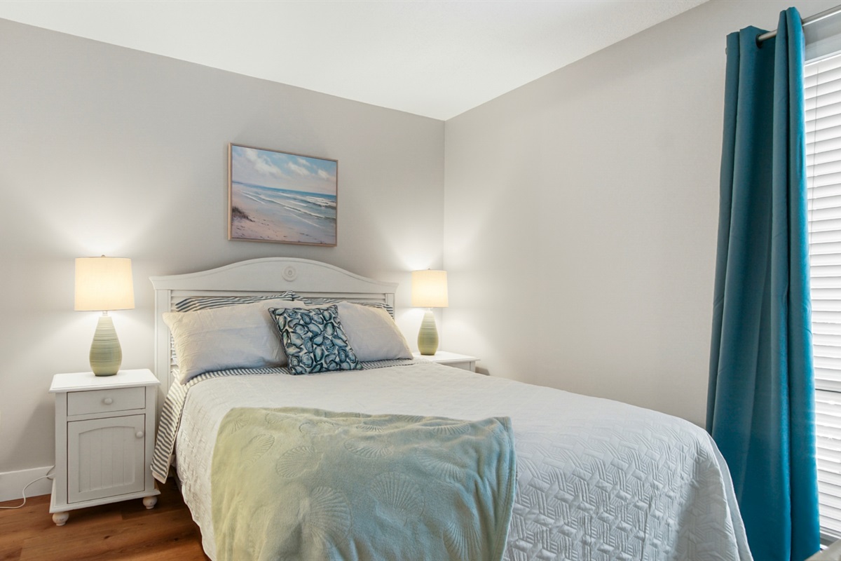 Second bedroom with queen bed, and bathroom access