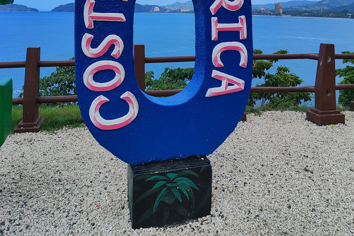 Sign of Jaco and view of Jaco