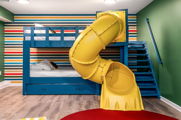bunk room with tube slide
