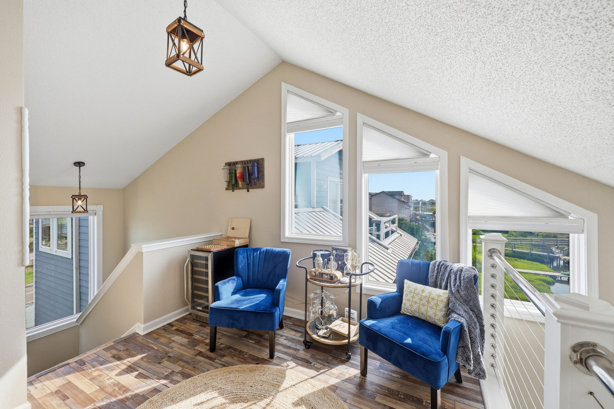Seriously... It doesn't get any cooler than this!  Blue velvet chairs, a wine fridge, and the most beautiful coastal views. Slow down and enjoy good company, great music, and a glass of wine!