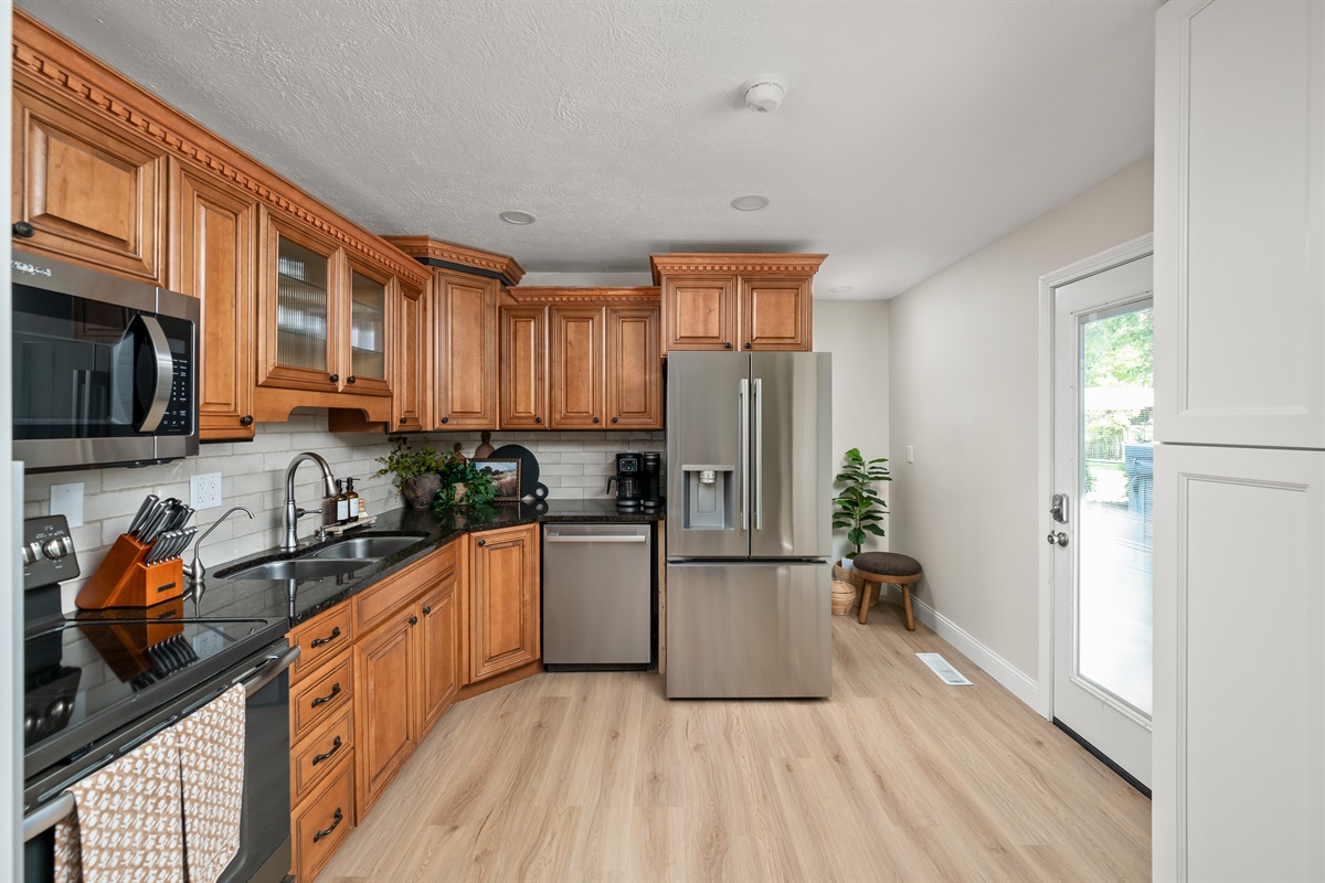 Kitchen features newly installed stainless steel appliances for a clean, modern feel and all the convenience of home.