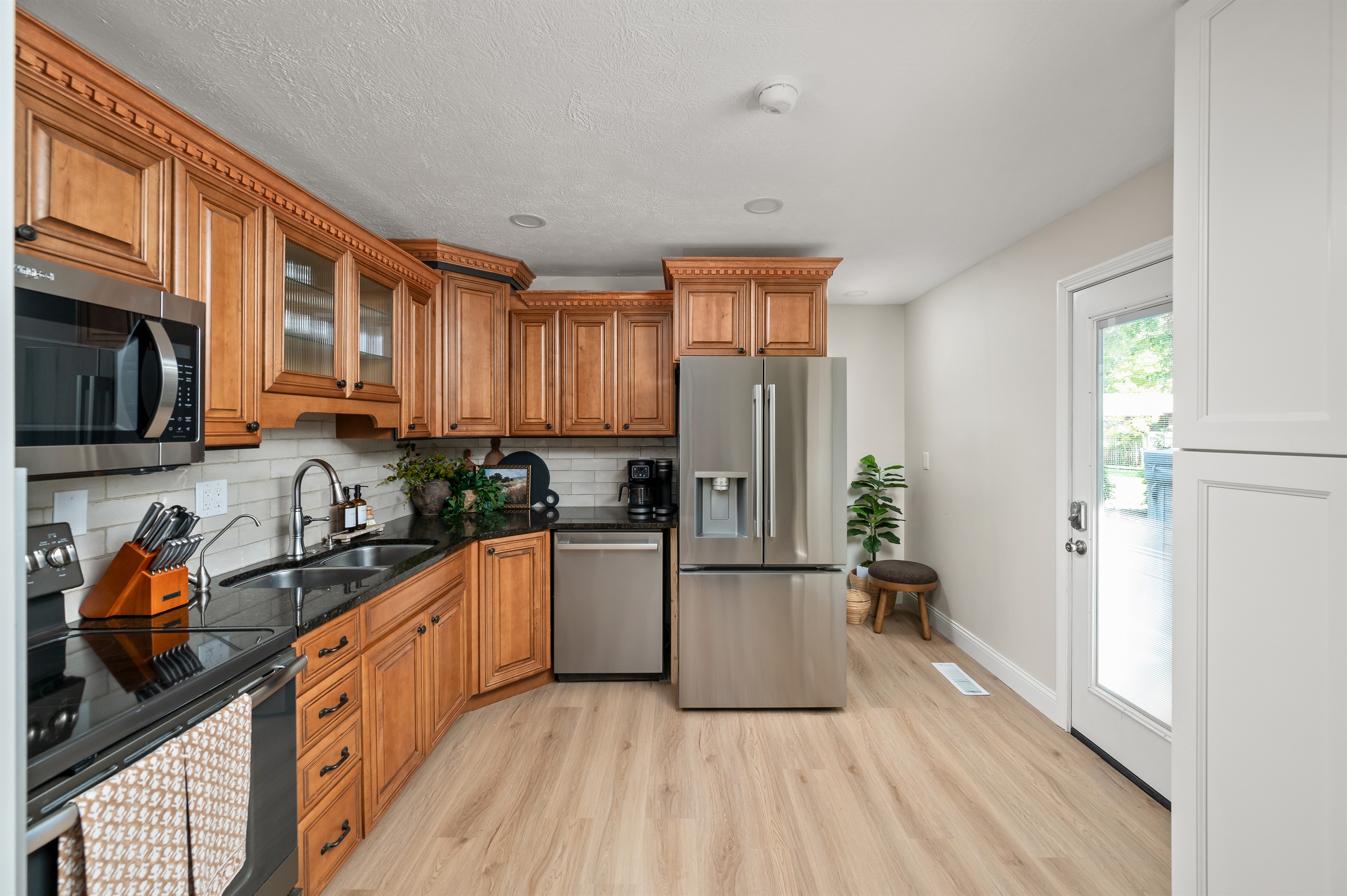 Kitchen features newly installed stainless steel appliances for a clean, modern feel and all the convenience of home.