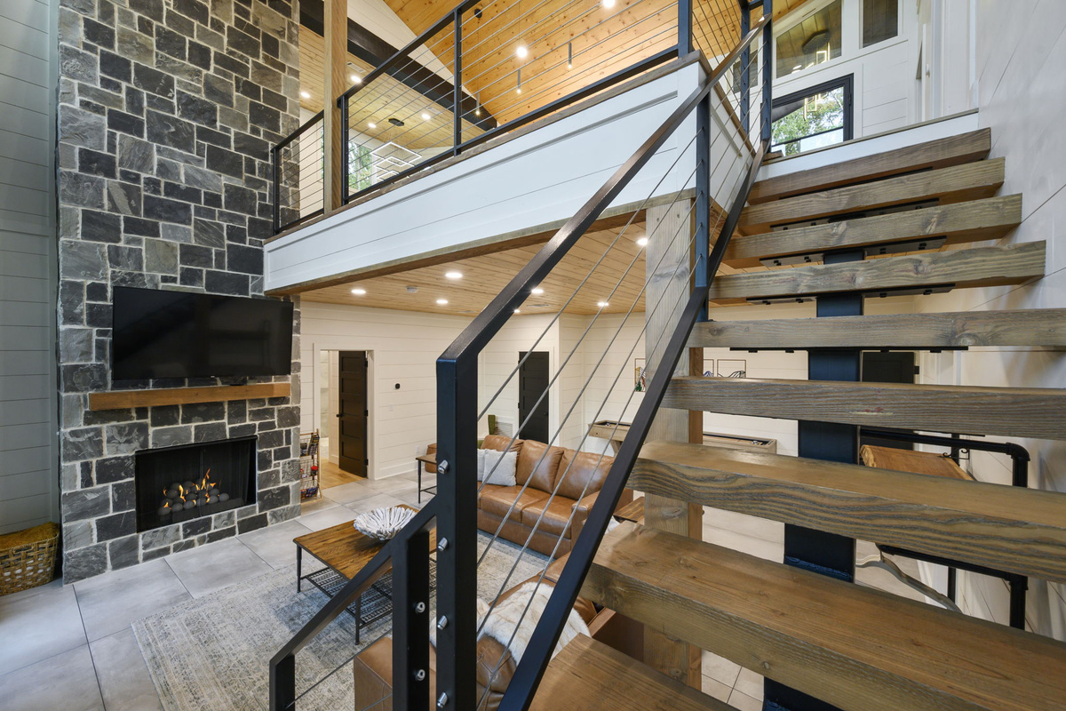 The heart of Fossil Rock features soaring ceilings, inviting seating, and a cozy statement fireplace.