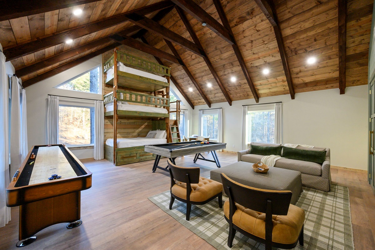 Epic loft with custom built-in bunks and full-size pool table 🎱 &mdash; the ultimate hangout space.