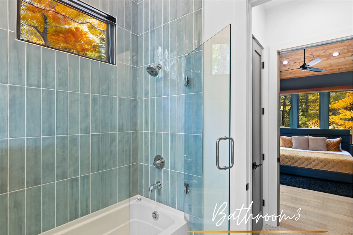 A bright and stylish bathroom with a combination tub and shower, offering both comfort and convenience.