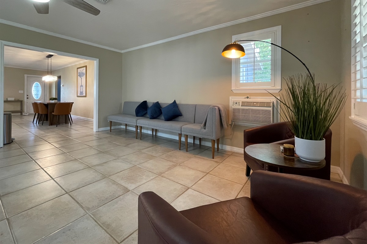 Our expansive rear living room has an abundance of seating and cozy nooks, as well as a comfortable couch with recliners.