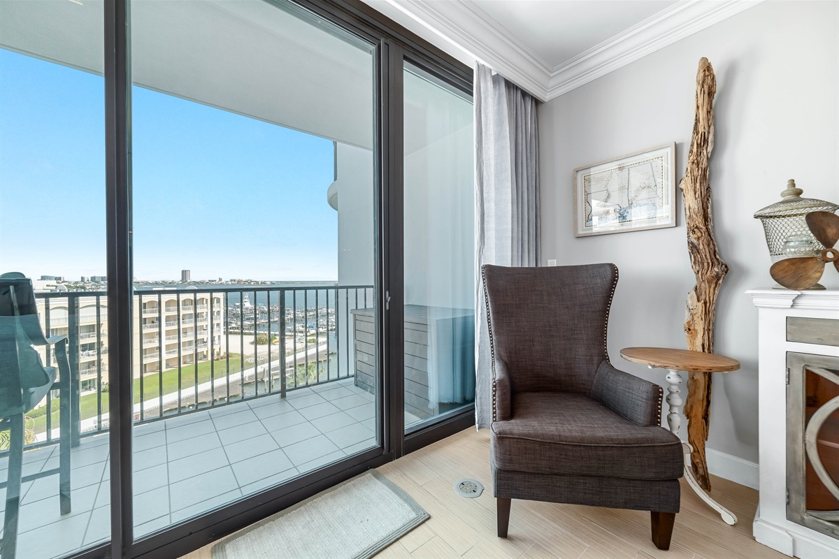 A tranquil corner offering the perfect spot to unwind and soak in the breathtaking ocean views. This cozy chair invites moments of peaceful contemplation.